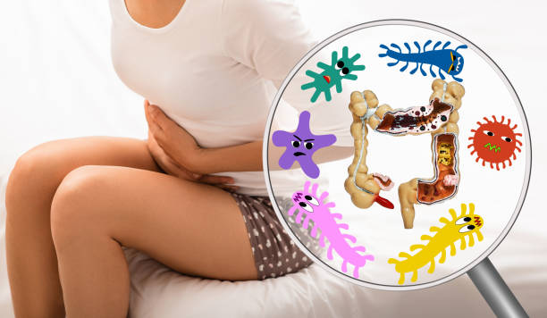 Pain in woman's intestines and abdomen. Dysbacteriosis, inflammation of intestines, abdominal bloating Pain in woman's intestines and abdomen. Dysbacteriosis, inflammation of intestines, abdominal bloating crohns disease stock pictures, royalty-free photos & images