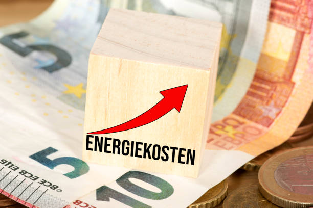 Euro banknotes and coins and rising energy costs Euro banknotes and coins and rising energy costs energy crisis stock pictures, royalty-free photos & images