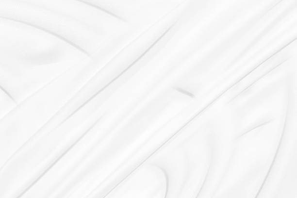 istock fashion textile Clean woven beautiful soft fabric abstract smooth curve shape decorative white background 1405617790