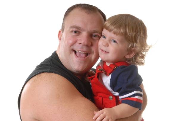 istock Portrait of father and son in studio 1405617950