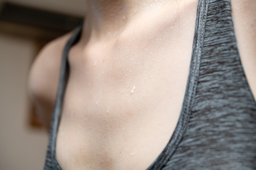 Chest of a woman who sweats after exercising