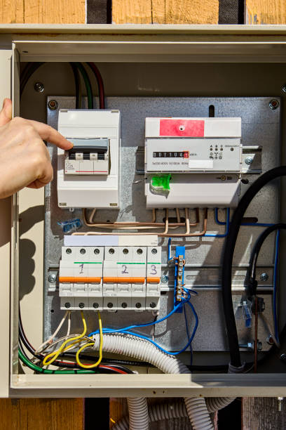 istock Turning circuit breaker in consumer unit with  electrical  meter. 1405619441