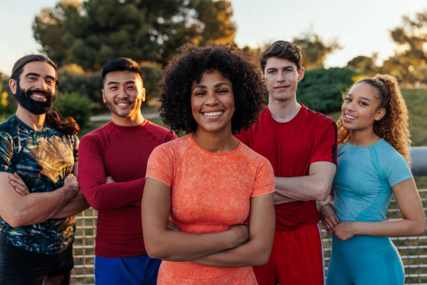 istock Female athlete standing in front of team 1405620024