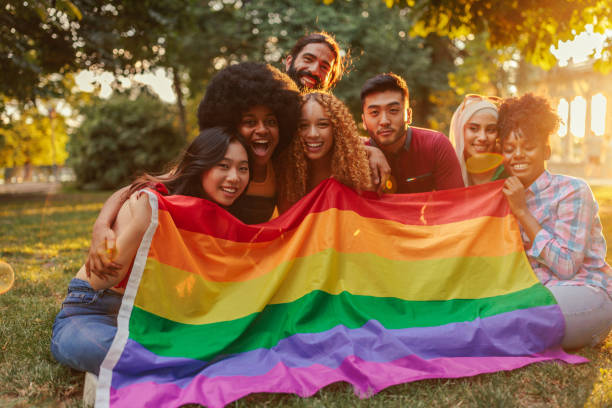 istock Friends celebrating pride month in park 1405620050
