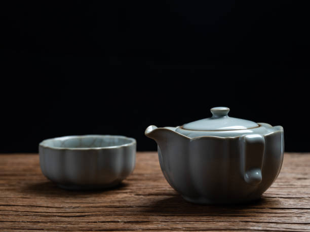 Chinese Ru ware Tea cup and Teapot on Black Background