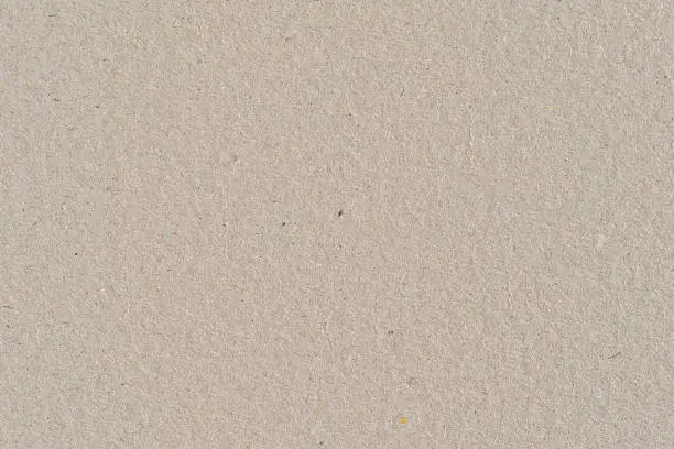 Beige color cardboard recycled paper, seamless tileable texture, image width 20cm.