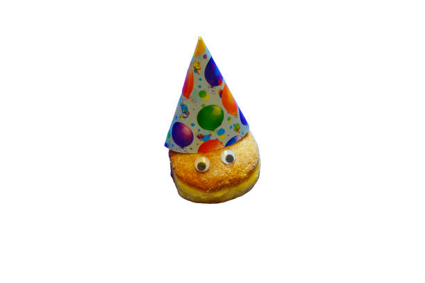 istock Single Donut with Party Hat isolated 1405625983