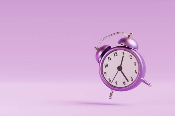 istock Vintage ringing alarm clock on purple background. 3d render 1405627218