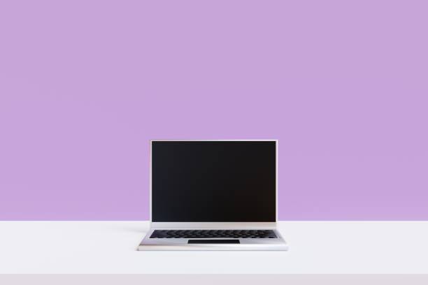 istock Front view school desk with laptop on pink background. 3d render 1405627244
