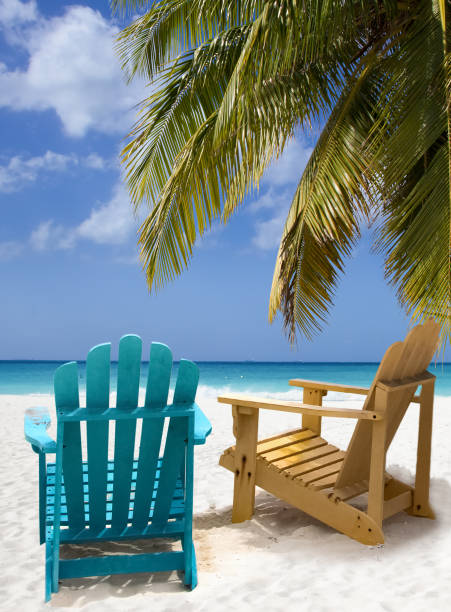 istock Two wooden beach chairs on Caribbean coast 1405629002