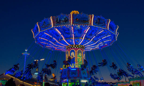 Rotating chain carousel at the blue hour on the Oktoberfest, Munich, Bavaria, Germany, Europe, 03. October 2019