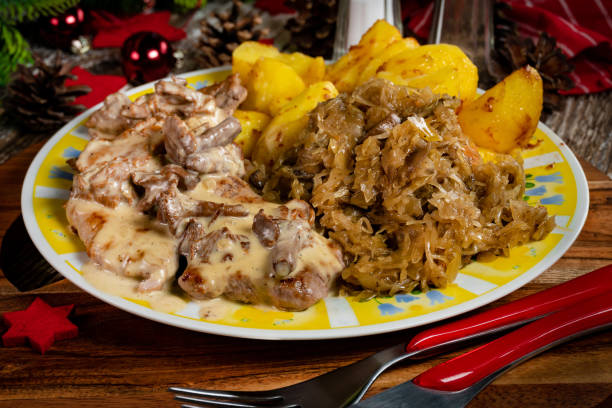 istock Stewed pork loin in a sauce with chanterelles. 1405630757