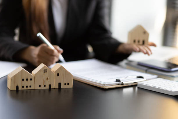 Real estate contract signing concept. Businesswoman signing a contract to legally for the purchase, mortgage and rental of real estate. stock photo