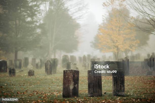 Three Gravestones Standing In A Foggy Graveyard During The Fall Stock Photo - Download Image Now