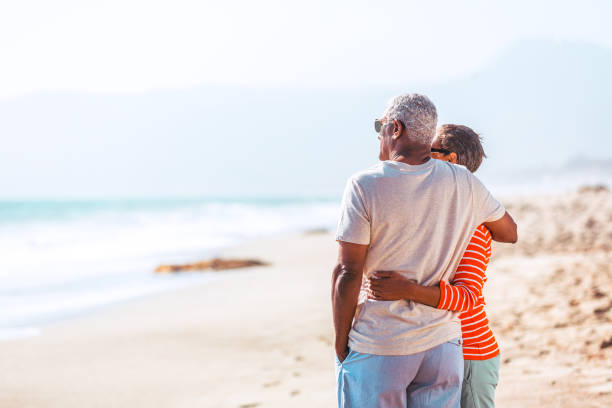 istock Senior African American couple embracing on beach 1405632555