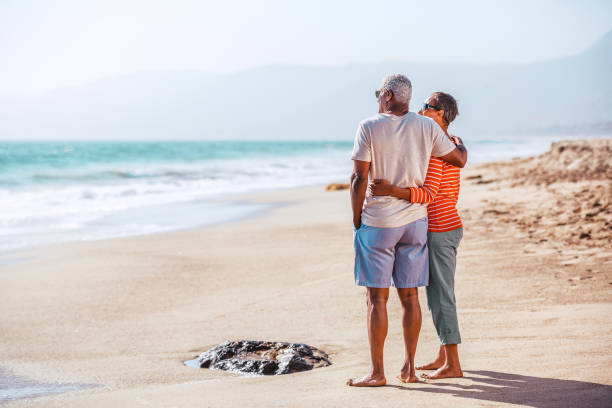 istock Senior African American couple embracing on beach 1405632567