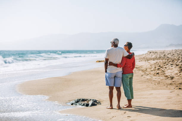istock Senior African American couple embracing on beach 1405632586
