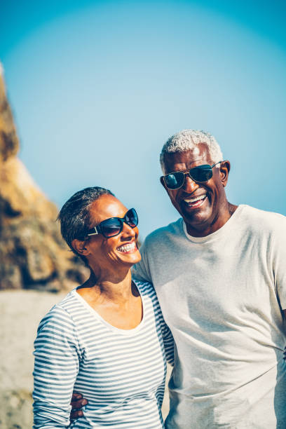 istock Senior African American couple standing at beach 1405632997