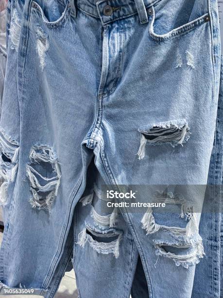 Image Of Bleached Preripped Blue Denim Jeans Focus On Foreground Stock ...