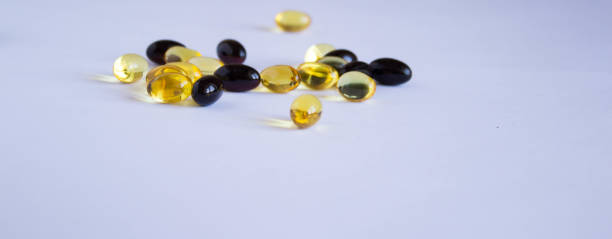 istock astaxanthin and fish oil. Gel capsules on white background 1405635071
