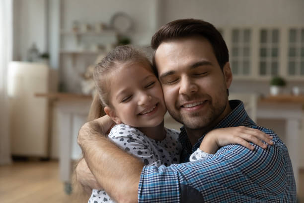 istock Head shot loving father and 8s daughter touching cheeks 1405636342