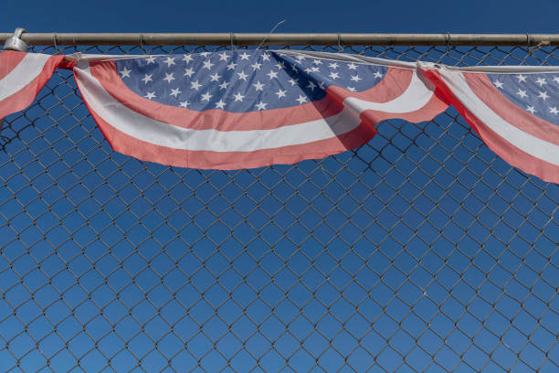istock Patriotic Bunting on a Baseball Fence 1405637285