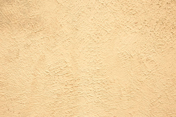 istock Beige background of the plastered wall. Close up. 1405637928