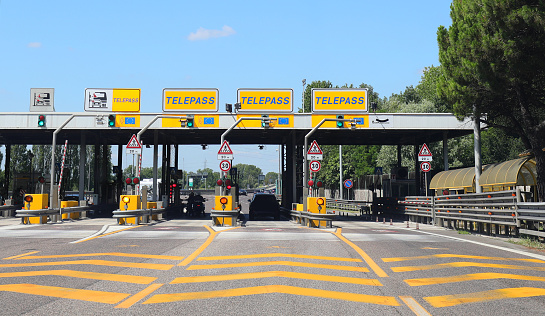 Mestre, VE, Italy - July 19, 2020: motorway toll booth with the text TELEPASS indicating the gate for the automatic payment