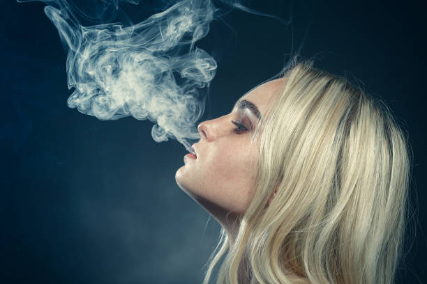 istock blond woman smoking 1405639278