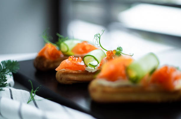 istock Eclairs with salmon, fresh vegetables and herbs, gourmet snacks. 1405641992