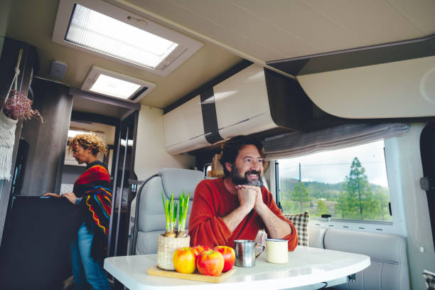 istock Happy Mature Man Sitting In Motor Home 1405643138