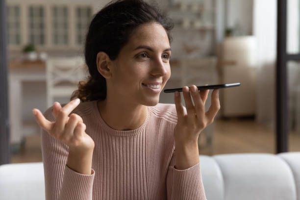 istock Confident millennial hispanic lady send voice message using voicemail app 1405643461