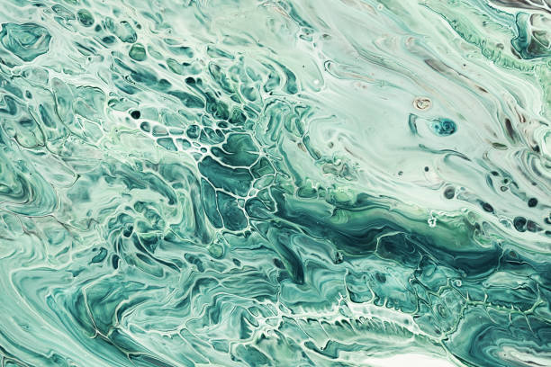istock Fluid Art acrylic paints. Abstract mixing green waves. Liquid flows splashes. Marble effect background or texture 1405643613