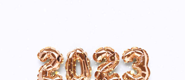 istock Banner with shiny 2023 gold inflatable balloons. 1405645002