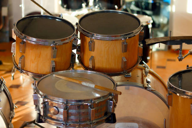 istock Drum set illuminated by the rays of the setting sun in a music studio. Closeup. 1405645227