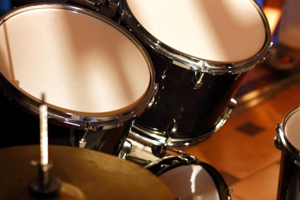 istock Drum set illuminated by the rays of the setting sun in a music studio. Closeup. 1405645908