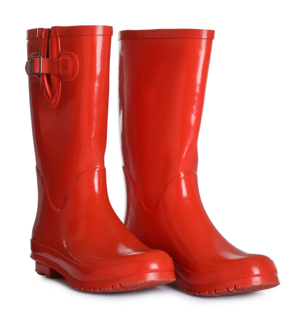 Modern red rubber boots isolated on white Modern red rubber boots isolated on white rubber boot stock pictures, royalty-free photos & images