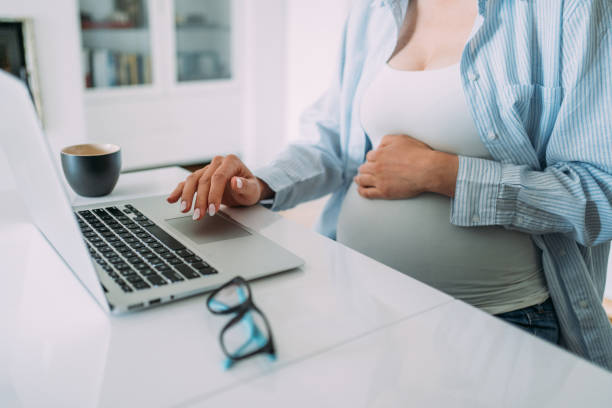 istock Pregnant woman working from home. 1405648870