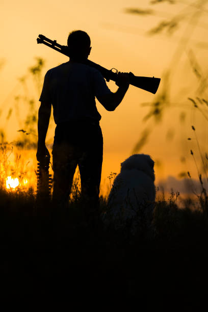 istock Man and dog silhoette 1405650192