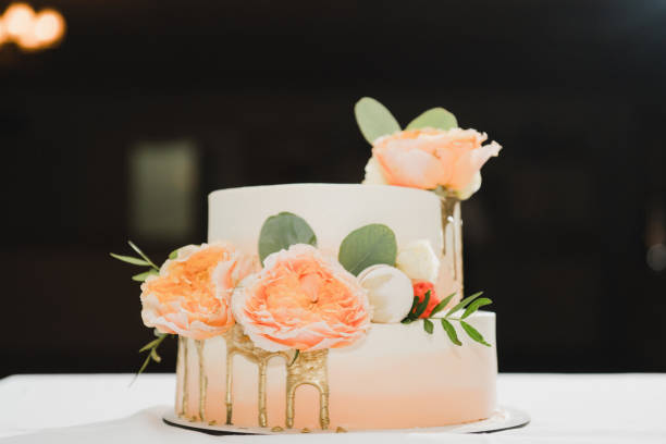 istock Beautiful wedding cake decorated with fresh flowers and greenery. 1405650330