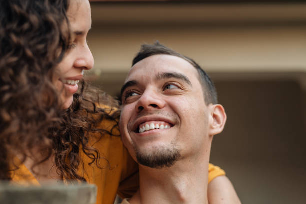 istock Smiling young couple in the backyard 1405654517