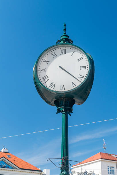 istock Large green retro street clock. 1405655226
