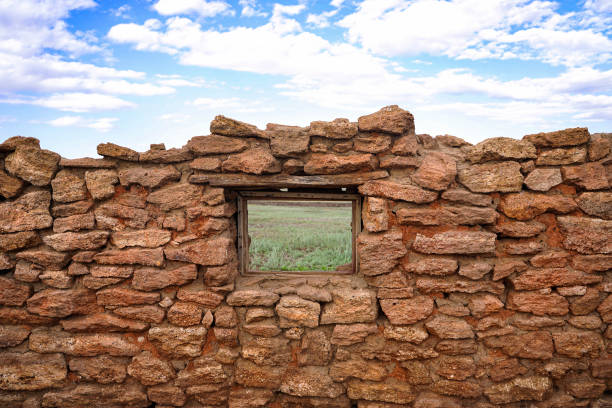 vintage wall with window wallpaper background blue sky with clouds. High quality photo