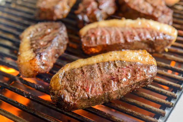 Picanha barbecue with blurred background. This form of barbecue is widely consumed throughout Brazil. stock photo
