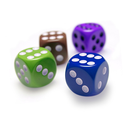 four colored dice each with the figure 6 in the upper face - concept of success