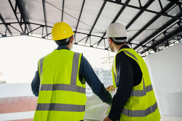 istock Civil Engineer and Construction Supervisor inspect the internal construction of building at construction site. Construction engineers or architect and Foreman inspect the construction inside building. 1405660021