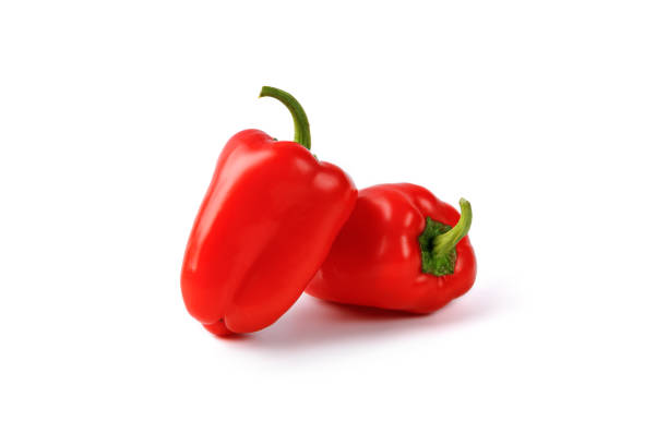 dois mini pimentões vermelhos, páprica isolada em um fundo branco. monte, grupo, conjunto de mini pimentões. comida diet vegana. - pepper bell pepper portion vegetable - fotografias e filmes do acervo