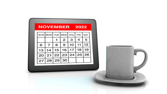 November 2022 calendar on Tablet PC and Coffee Cup