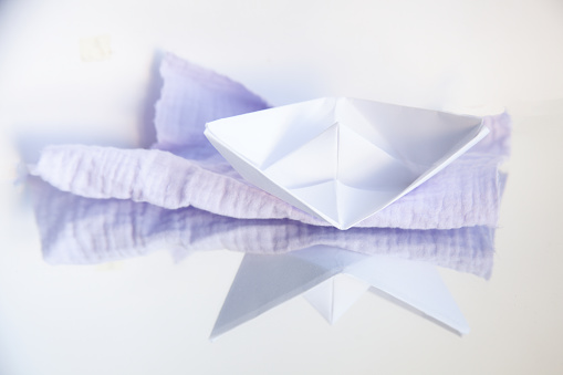 Paper boat on a rag sea. \nDid you know that March 28 is Paper Boat Day? Me not.