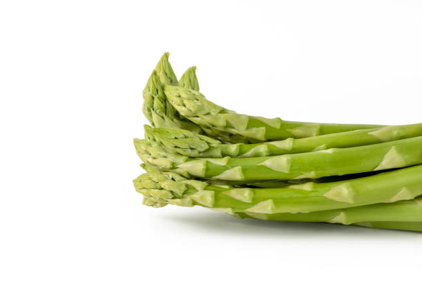 istock Fresh green asparagus on a white isolated background. Green asparagus isolate with shadow on white background. 1405668579